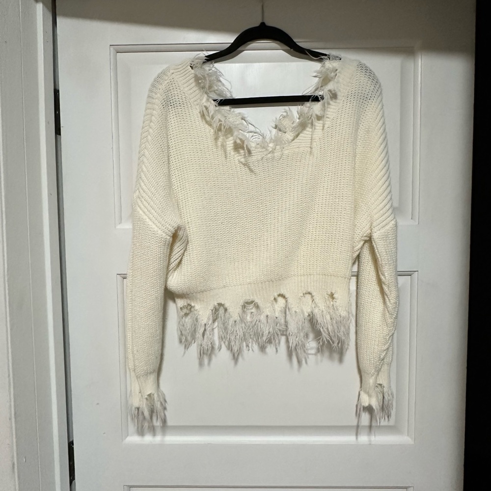 cropped off the shoulder sweater with raw hem